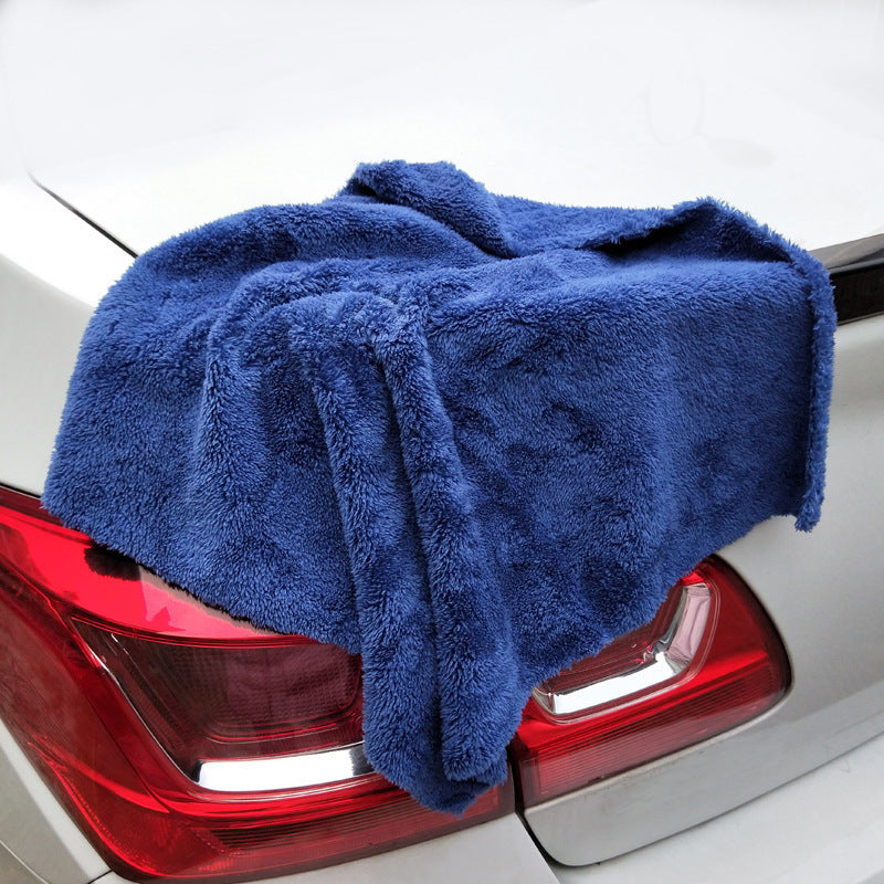 Microfiber towel absorbing water on car