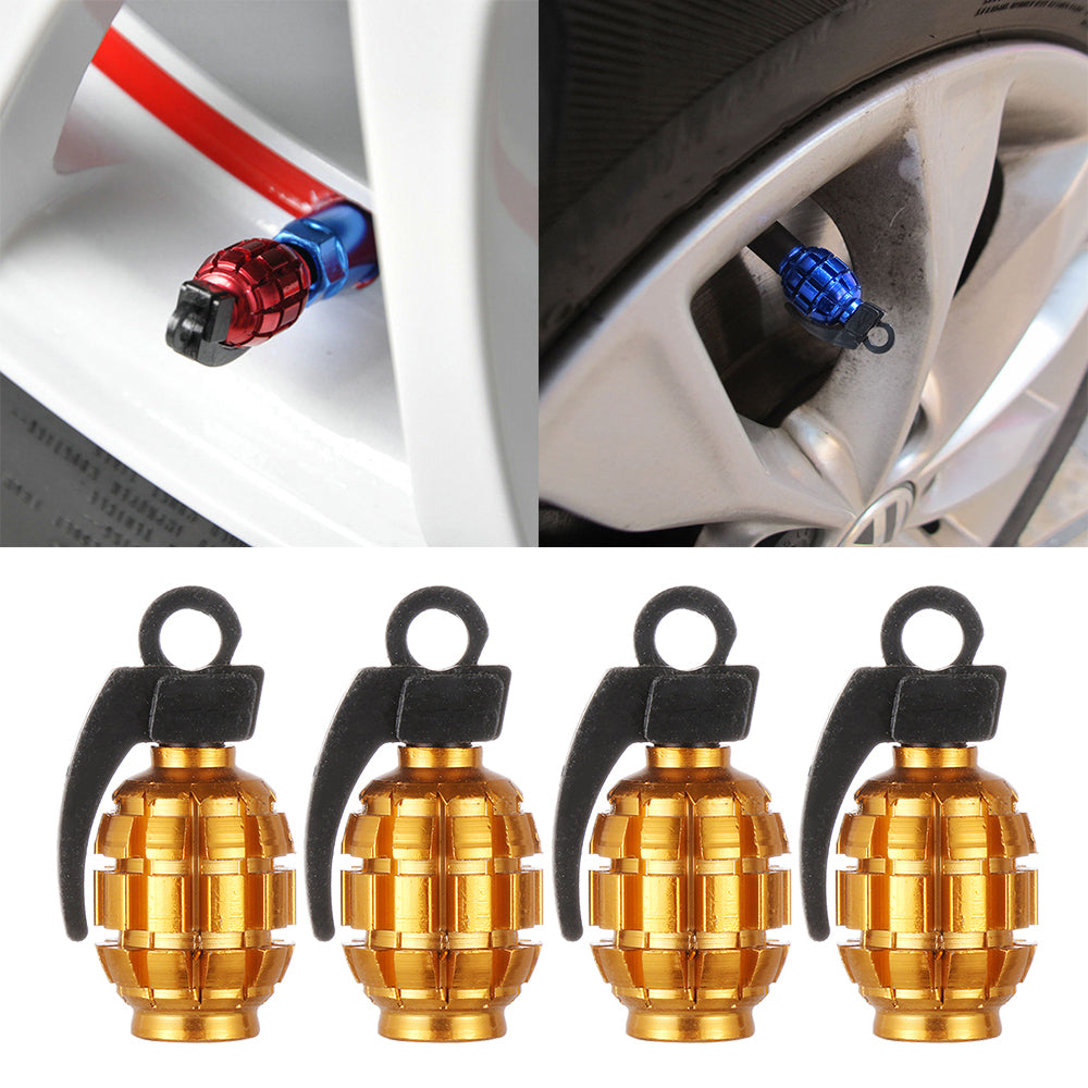 Gold grenade-style tire valve stem caps, close-up
