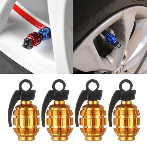 Gold grenade-style tire valve stem caps, close-up